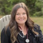 Home health nurse Chelce smiles while she sits on a chair outdoors